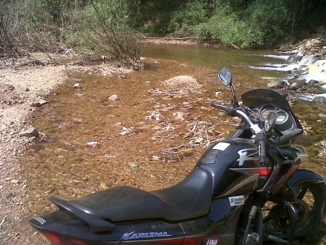 The ZMA parked at a river bank near Achankovil, had spotted a few snakes en-route and I feared they might crawl inside the ZMA's fairings, hence the precautionary measure.